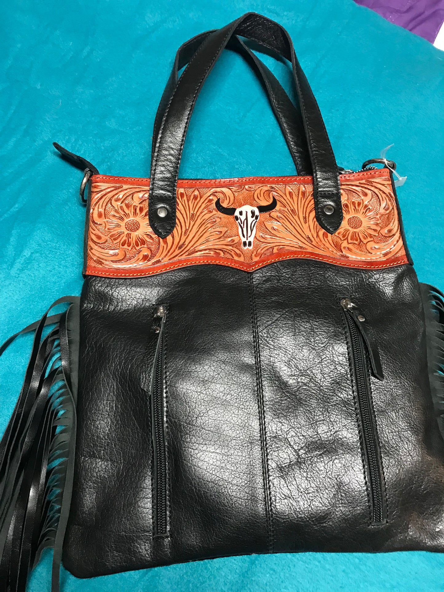 Black and white hid with brown leather trim purse