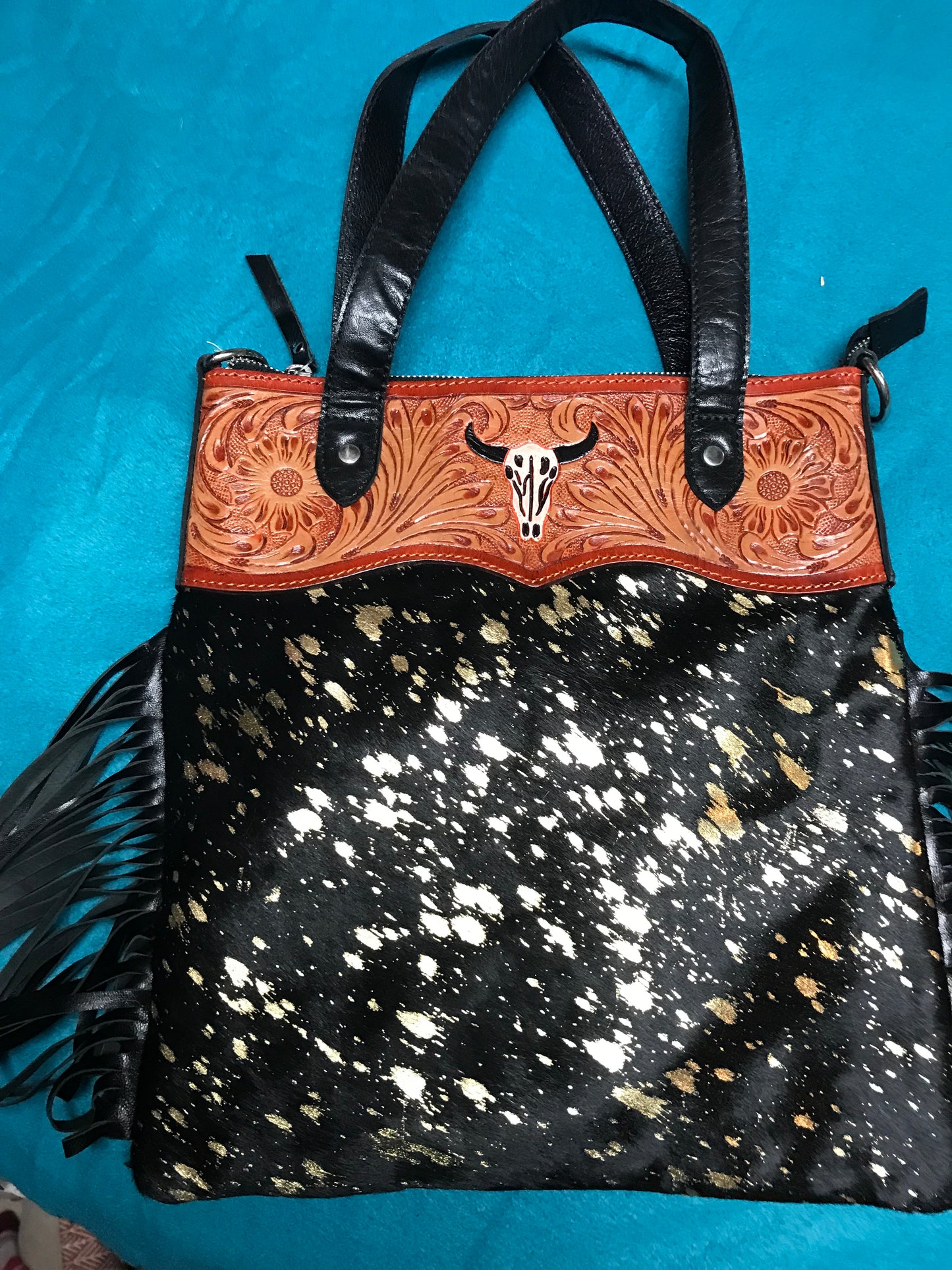 Black and white hid with brown leather trim purse