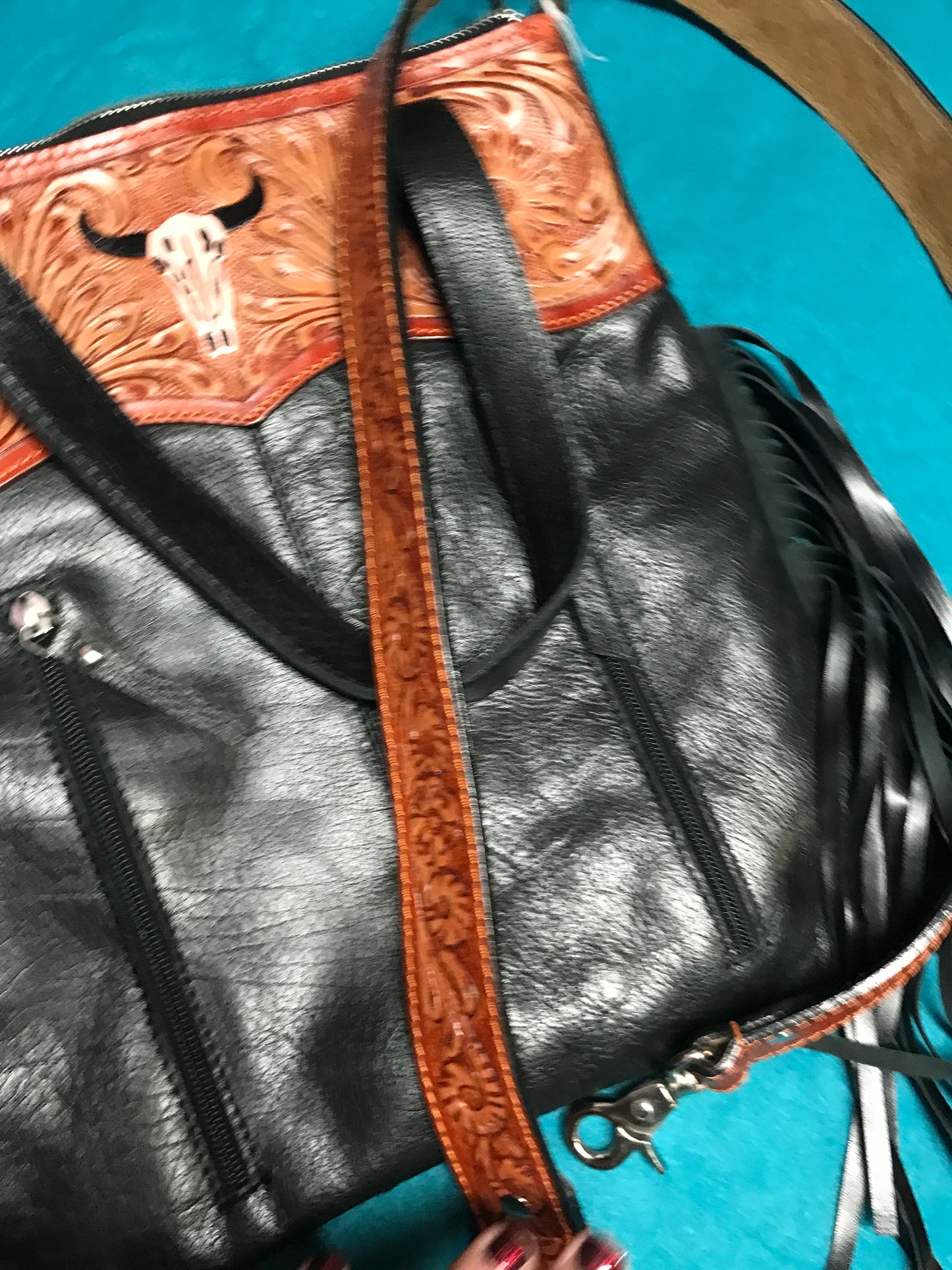 Black and white hid with brown leather trim purse