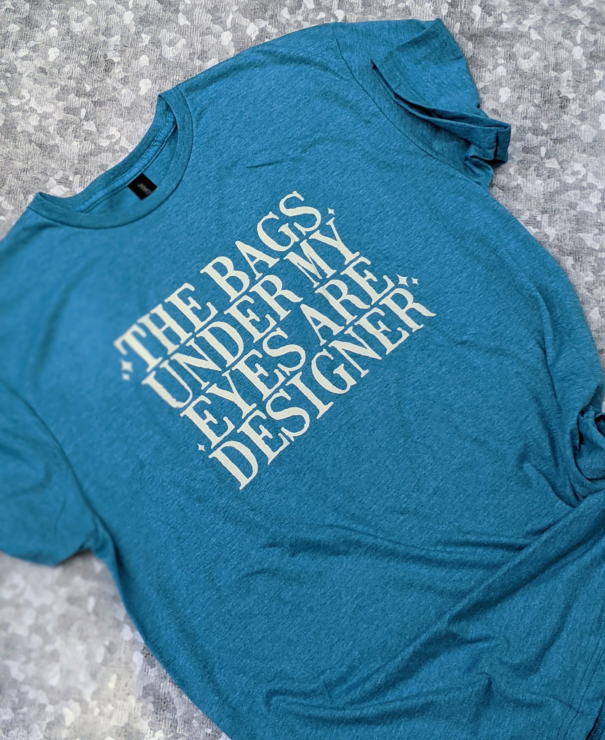 The bags under my eyes are designer t-shirt/designer t-shirt/snarky/sassy/funny/unisex shirt/funny gift/soft feel t-shirt