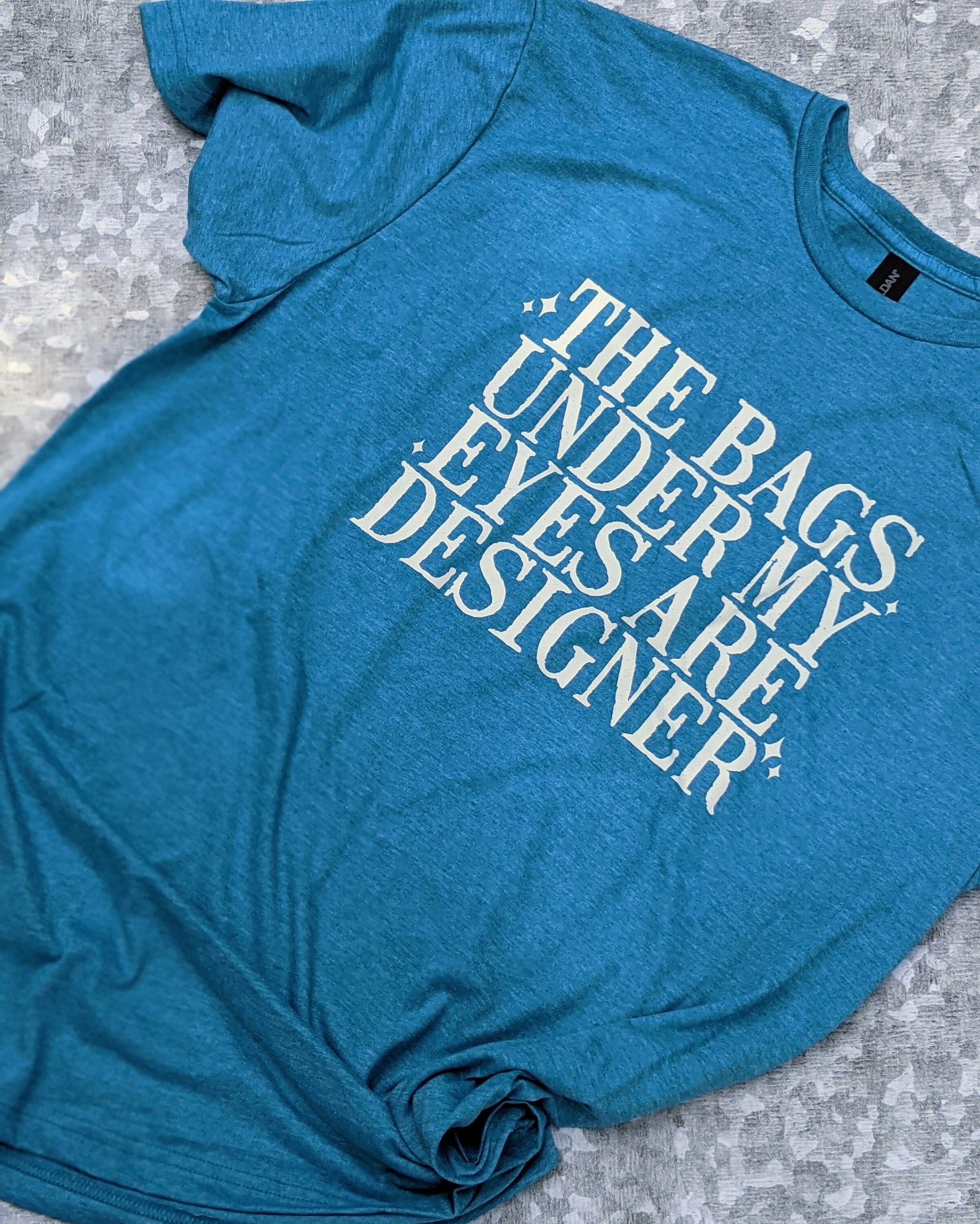 The bags under my eyes are designer t-shirt/designer t-shirt/snarky/sassy/funny/unisex shirt/funny gift/soft feel t-shirt
