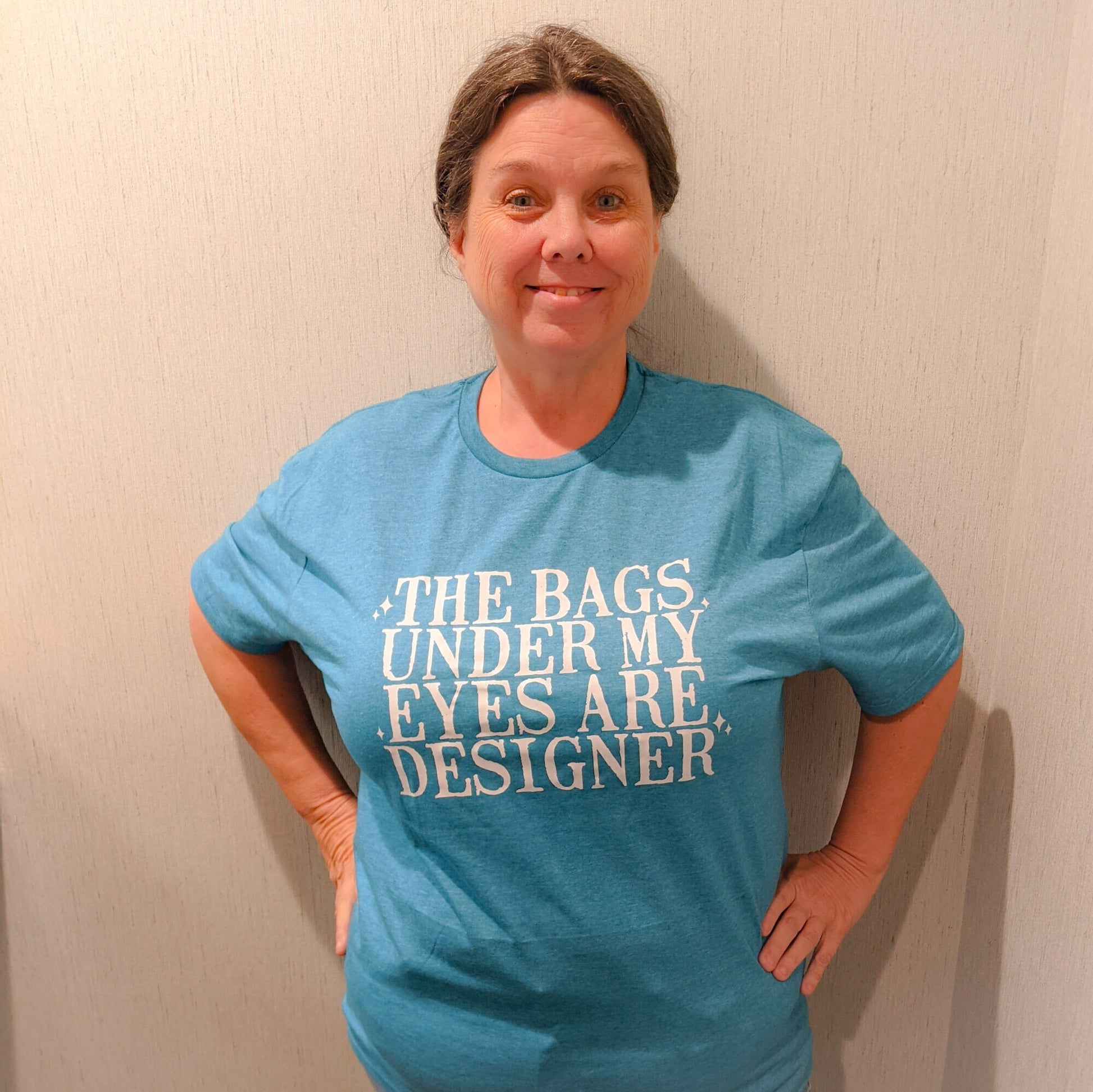 The bags under my eyes are designer t-shirt/designer t-shirt/snarky/sassy/funny/unisex shirt/funny gift/soft feel t-shirt
